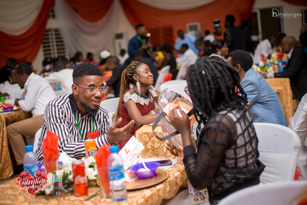 People in conversation around a dinner table